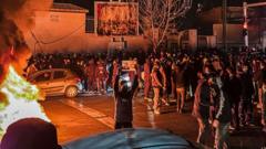 Iran warns it will retaliate if US attacks as protesters defy crackdown